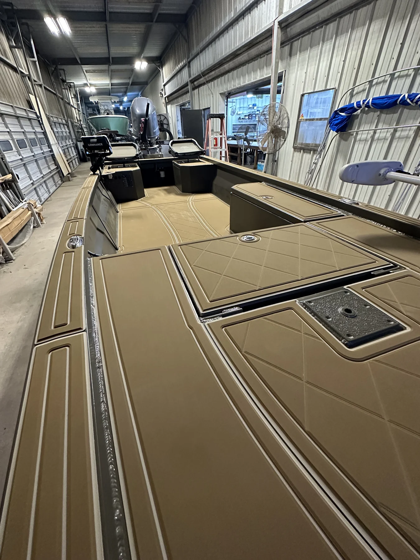 Tan geometric panels inside an aluminum fishing boat.