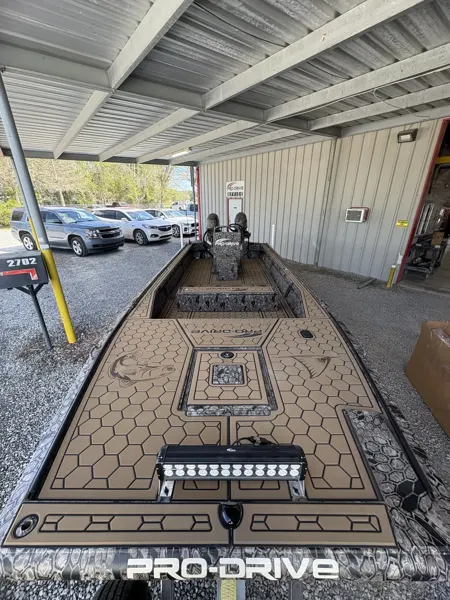 Custom patterned tan flooring inside a Pro-Drive hunting boat.