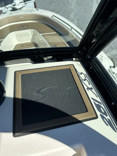 A custom motif set into the flooring below a boat windshield.