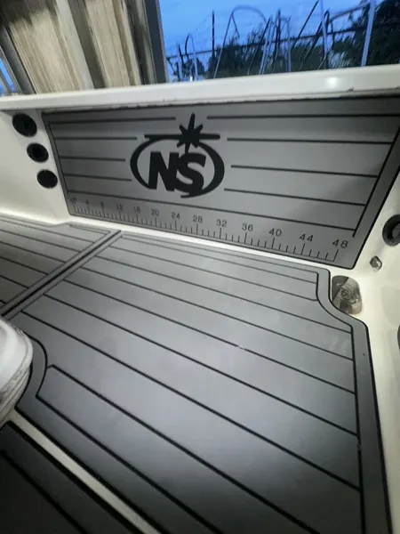 Custom initials integrated into gray deck panels.